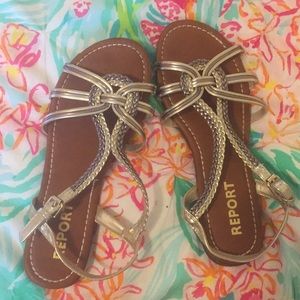 Sandles that are gold and leather